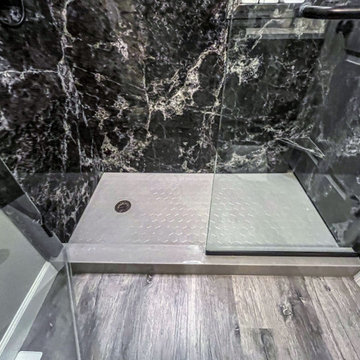 Guest Bathroom with Onyx Cabinets and Tyvarian shower