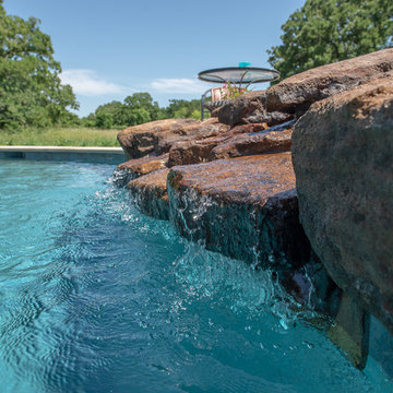 Rustic freeform pool and spa waterfall in Anderson TX