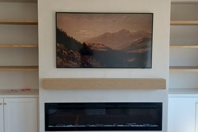 Inspiration for a contemporary living room remodel in San Diego with a plaster fireplace and a ribbon fireplace