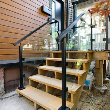 Timber Front Staircase with Glass Guards and Black Handrails | East York