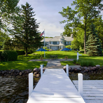 Lakefront Elevation with Wood Dock and Bluestone Walkway up from the Water