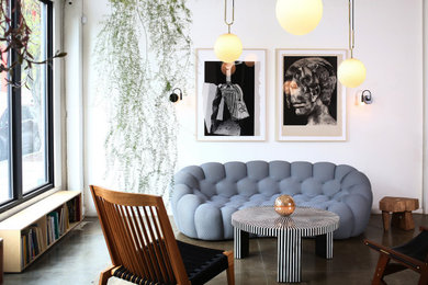 Living room - mid-sized modern loft-style concrete floor and gray floor living room idea in Portland with white walls, no fireplace and no tv
