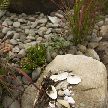 Collecting rock next to pebble fountain