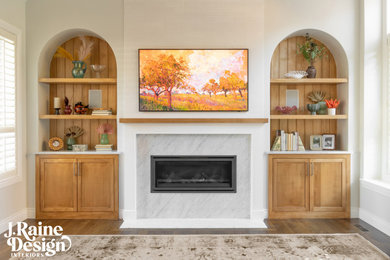 Family room - large transitional medium tone wood floor and brown floor family room idea in Detroit with white walls, a standard fireplace, a stone fireplace and a wall-mounted tv