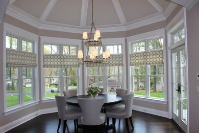 Mid-sized elegant dark wood floor and brown floor enclosed dining room photo in New York with gray walls and no fireplace