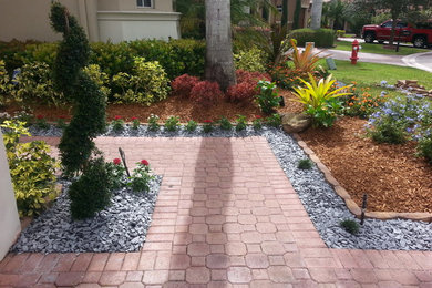 Inspiration for a full sun front yard landscaping in Miami for spring.