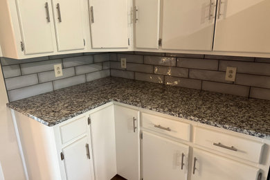 Kitchen - modern kitchen idea in Other