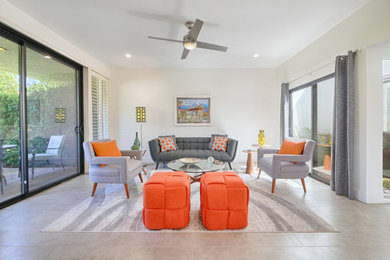 Example of a mid-sized mid-century modern open concept gray floor living room design in Other with no tv