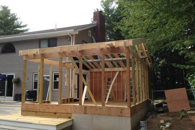 Example of a beach style home design design in Boston