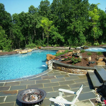 Delaware Township custom pool and raised spa with negative edge & water feature