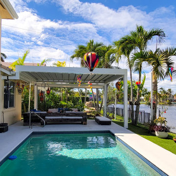 Retractable Pergola with Motorized Screens on Poolside Patio