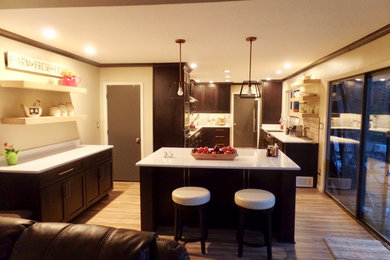 Inspiration for a large transitional u-shaped laminate floor and beige floor eat-in kitchen remodel in Other with a farmhouse sink, shaker cabinets, dark wood cabinets, quartz countertops, gray backsplash, porcelain backsplash, stainless steel appliances and an island