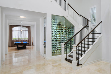 Huge tuscan marble floor and beige floor foyer photo in Miami with white walls