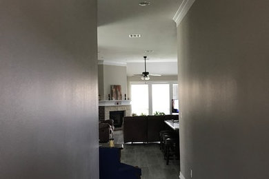 Inspiration for a small timeless porcelain tile entryway remodel in Austin with gray walls and a medium wood front door