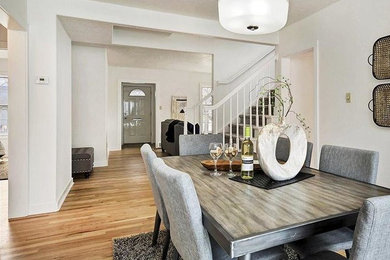 Example of a mid-sized 1950s light wood floor great room design in Boise with white walls