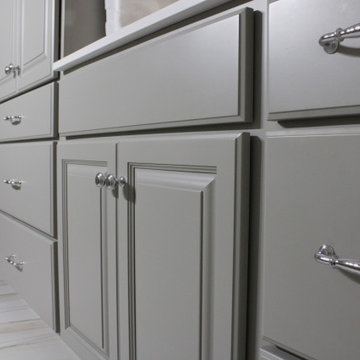 Intellectual Grey double vanity with white cultured marble and a linen tower