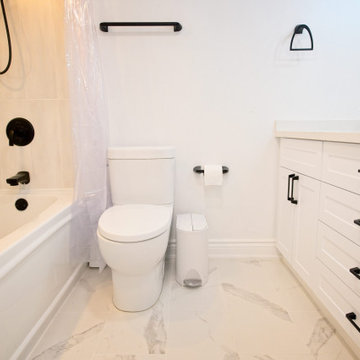 Tub-Shower Bathroom with White Drawer Vanity and Black Fixtures | Harbourfront T