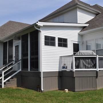 Custom shed roof porch with EZE Breeze windows and side grill deck