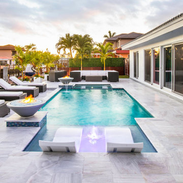 Custom Pool & Spa With Water and Fire Bowls in Pompano Beach