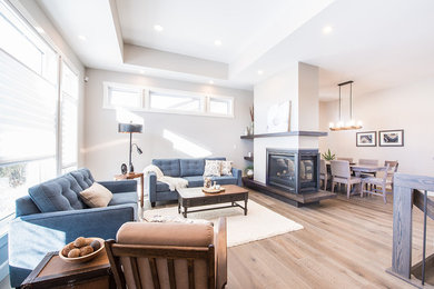 Design ideas for a transitional living room in Edmonton with a wood fireplace surround.