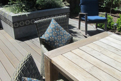 Design ideas for a mid-sized eclectic backyard partial sun garden for summer in San Francisco with decking.