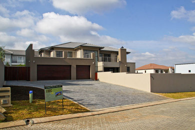 Inspiration for a large contemporary exterior home remodel in Other