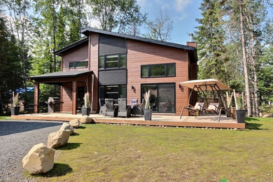 Example of a small trendy two-story mixed siding exterior home design in Montreal