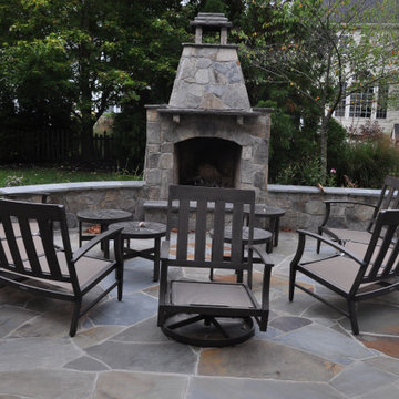 Down hill stone steps to the stone patio and fireplace.