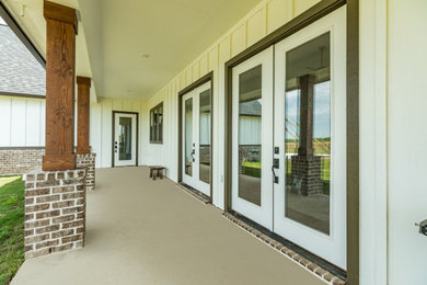 This is an example of a country porch design in Houston.