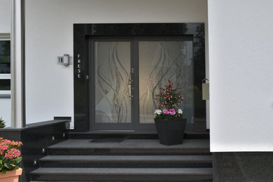 Inspiration for a mid-sized contemporary front door in Dortmund with a double front door.