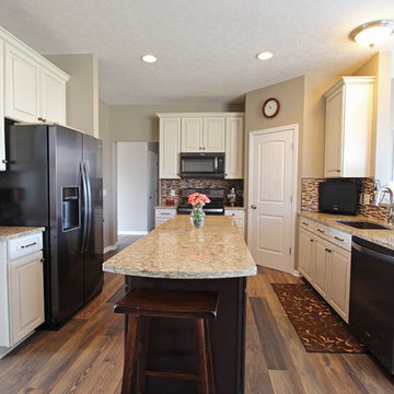 Cream Kitchen with Contrasting Dark Island with Quartz Countertop