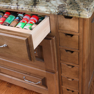 Large traditional kitchen pantry photos - Kitchen pantry - large traditional u-shaped medium tone wood floor kitchen pantry idea in Chicago with raised-panel cabinets, medium tone wood cabinets and granite countertops