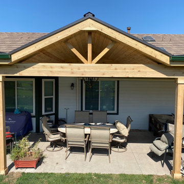 Patio roof cover with brick fireplace.