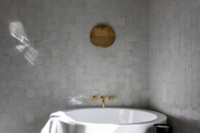 Bathroom - mid-sized transitional master gray tile ceramic tile and single-sink bathroom idea in Austin with a freestanding vanity