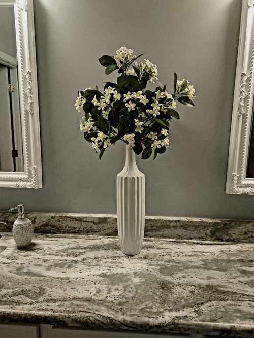 Wall between vanity mirrors