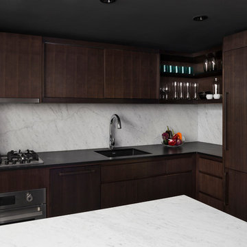 Village Kitchen with Dark Cabinets and Open Storage