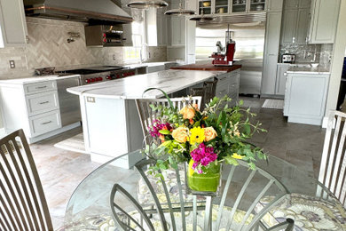 Kitchen/dining room combo - huge transitional porcelain tile and gray floor kitchen/dining room combo idea in Boston with gray walls