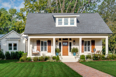 Example of a white clapboard house exterior design in Nashville with a shingle roof and a gray roof