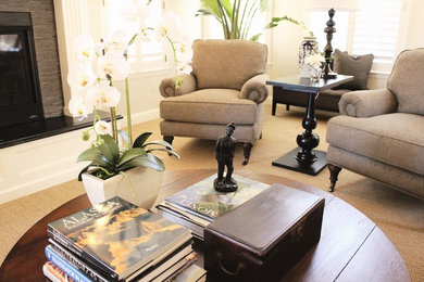 Example of a mid-sized classic open concept carpeted and beige floor living room design in San Luis Obispo with beige walls, a standard fireplace, a stone fireplace and a wall-mounted tv