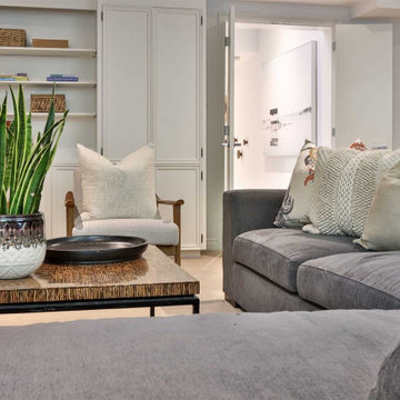 Family Room with Built In Bookcases and Mid-Century Chairs