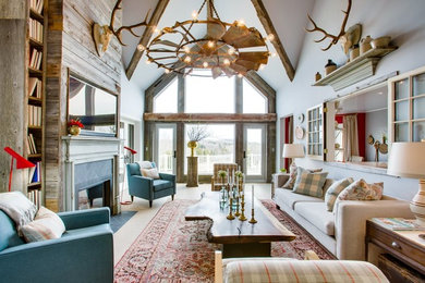Example of a large cottage open concept carpeted and beige floor family room library design in Toronto with white walls, a standard fireplace, a wall-mounted tv and a stone fireplace