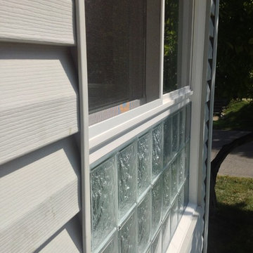 Sliding glass window with lower glass blocks for privacy