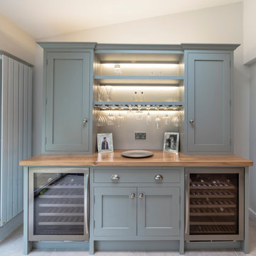 Bespoke Kitchen, intergrated living and dining with Ingenious rotating TV wall.