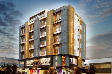 Huge contemporary three-story concrete apartment exterior idea in Other