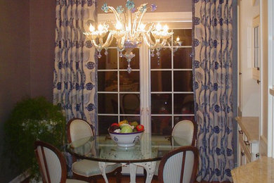 Example of a mid-sized classic medium tone wood floor enclosed dining room design in New York