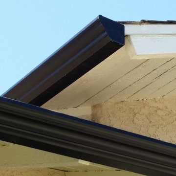 Triple Curve Rain Gutter in Black Aluminum.