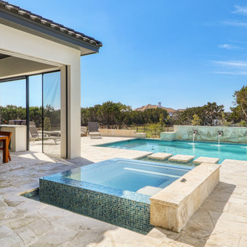 Chic Contemporary Pool with Negative Edge Spa