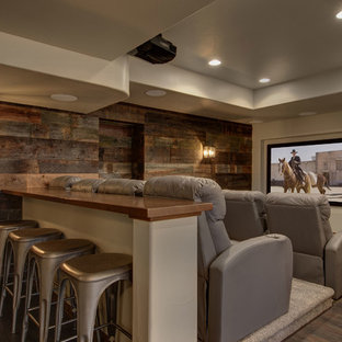 Large traditional look-out basement in Denver with grey walls, dark hardwood flooring, no fireplace and brown floors.
