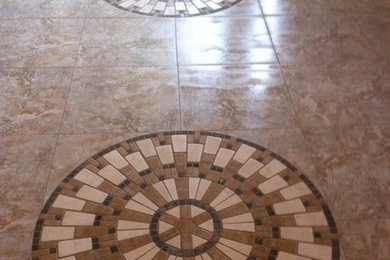 Elegant ceramic tile and beige floor entryway photo in Orange County