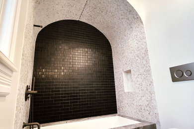Mid-sized mediterranean bathroom with an open shower.